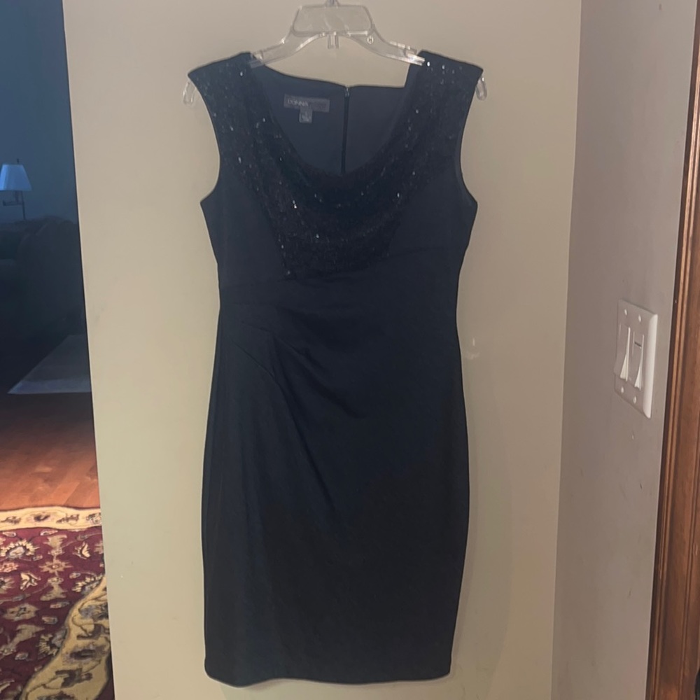 Never worn, size 6. Slate Grey with sequins chest.